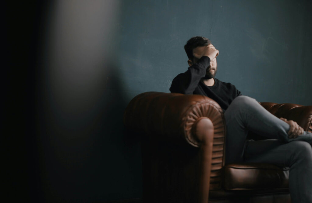 A man allowing himself to feel sad in the face of grief and loss