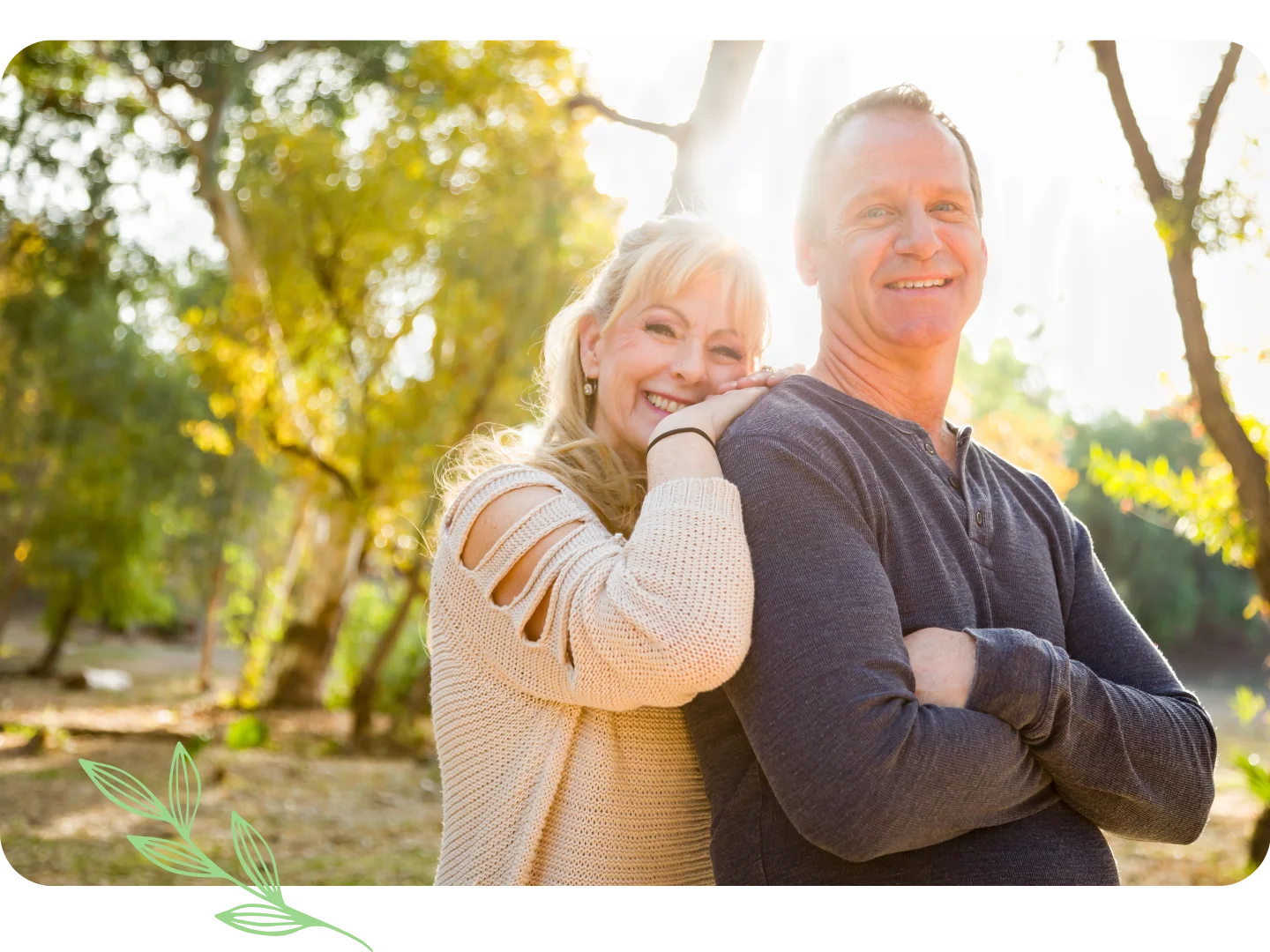 Smiling couple posing together in the sunlight